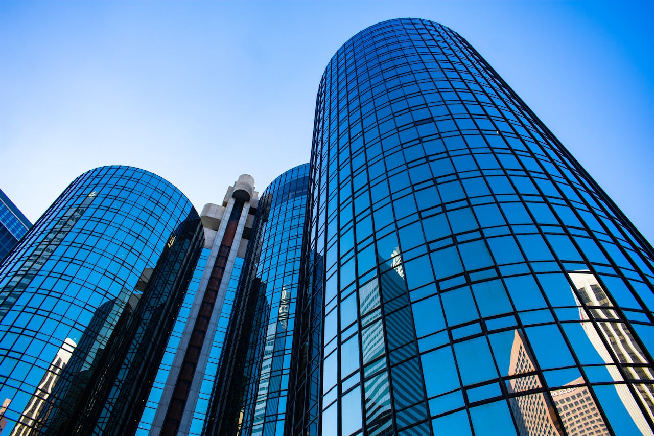 services-02 Low-angle view of reflective skyscrapers capturing the essence of urban Los Angeles architecture.